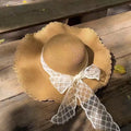 Chapeau de soleil taille unique en fibres tressées beige avec ruban en dentelle style large bord