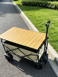 Chariot de jardin pliable 90 x 50 x 90 cm en acier noir et tissu beige avec plateau en bois